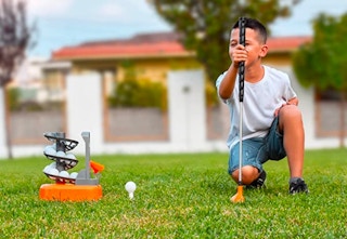 boy with toy golf set