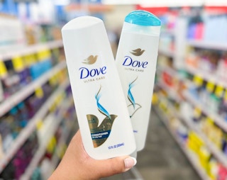 hand holding bottle of Dove shampoo and conditioner