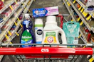 palmolive dish soap, crest toothpaste, nivea shave gel, arm & hammer detergent, and venus razors in a cart