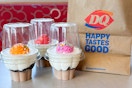 three dairy queen ice cream cupcakes on a table next to a dq top go bag 
