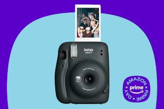 Fujifilm Instax Mini 11 Instant Camera on a blue background with a prime day sticker