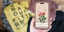 Someone holding a phone displaying the Anthropologie app next to an Urban Outfitters bag