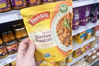 hand holding tastybite bombay potatoes at meijer