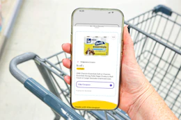 hand holding a smartphone displaying a 1-clip coupon in the kcl app