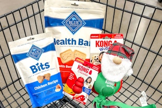 2 bags of blue buffalo dog treats and 2 kong dog toys in a cart