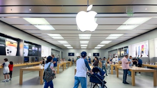 a family walking into an apple store