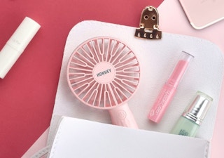 pink mini fan in a purse