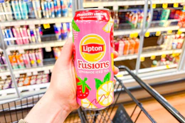 hand holding a can of lipton fusions tea