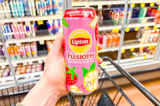 hand holding a can of lipton fusions tea