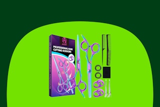 A hair cutting kit box, two pairs of scissors (one for thinning), two combs, and several accessories