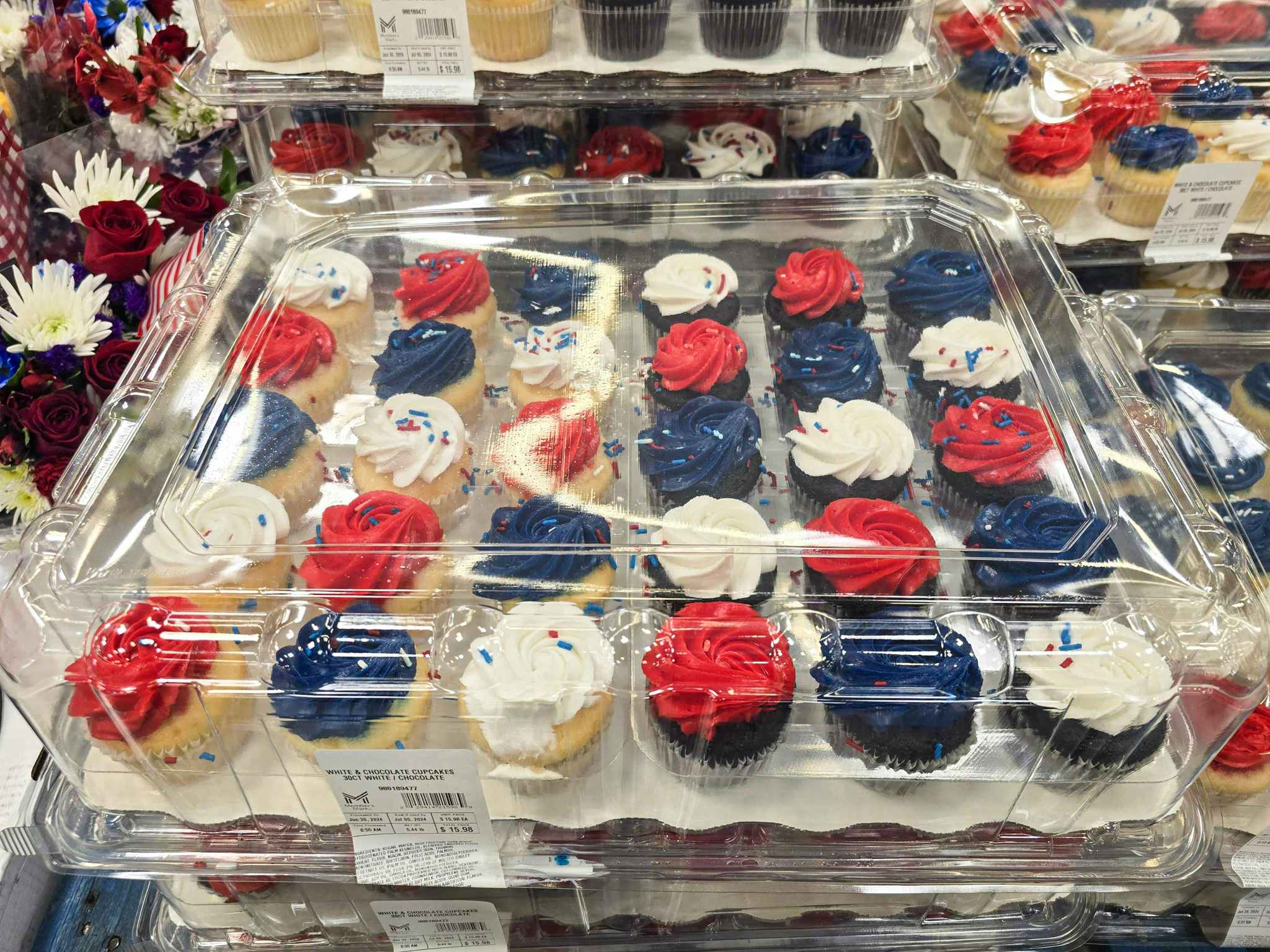 container of fourth of july decorated cupcakes