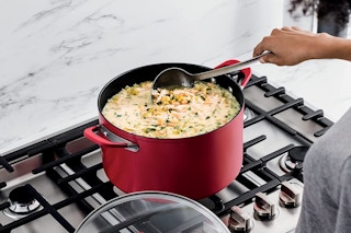 A person cooking with the Ninja Foodi stock pot