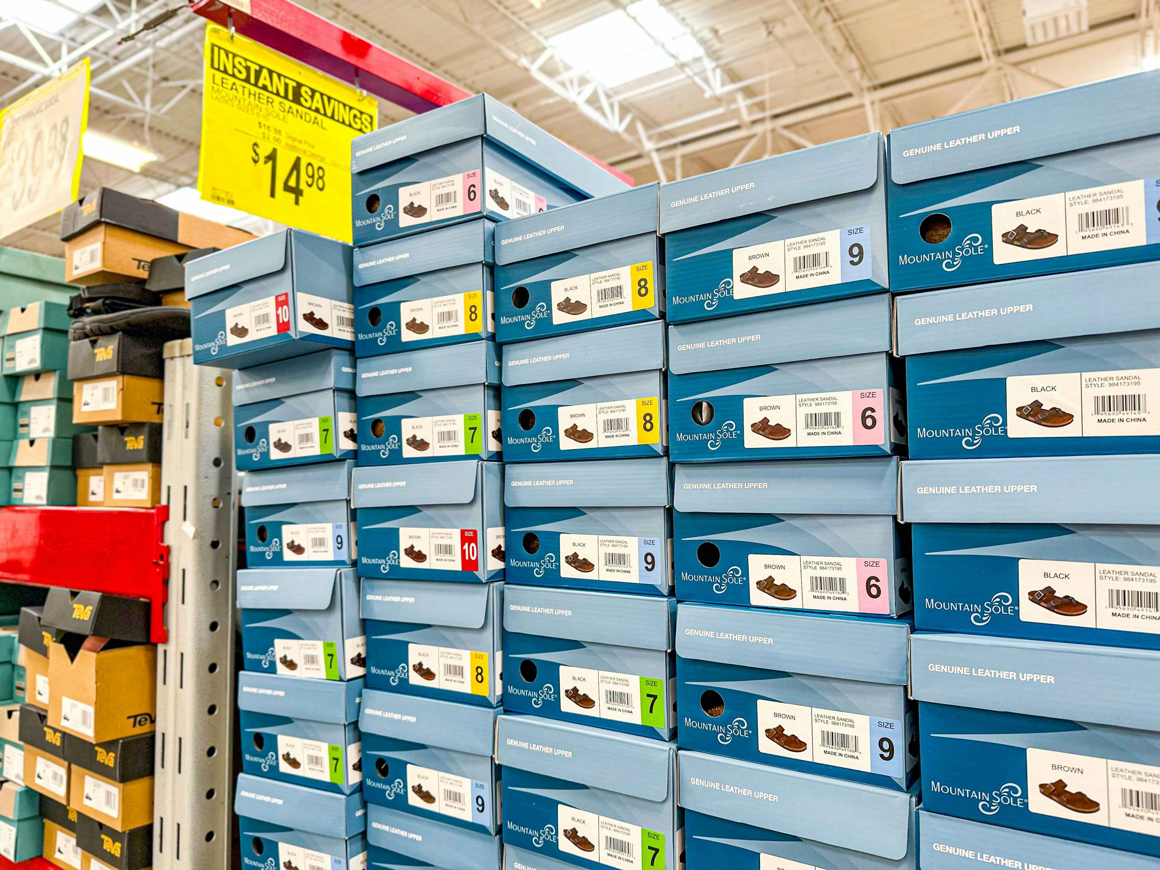 boxes of sandals with a $14.98 sign