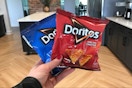 person holding Doritos snack size bags