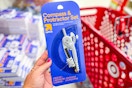 hand holding an up & up compass & protractor set at target