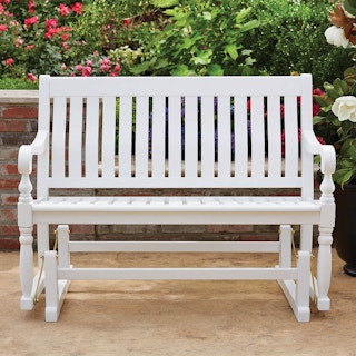 a wood painted white glider patio bench