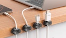 cords in small organizers on the side of a desk