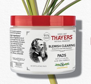 acne pads in a jar with a red top