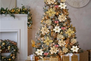 59PCS 6 Style Poinsettia Flowers Artificial Christmas Tree Decorations on a tree.
