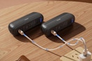OCOOPA 2 in 1 Magnetic Rechargeable Hand Warmers on a table charging.