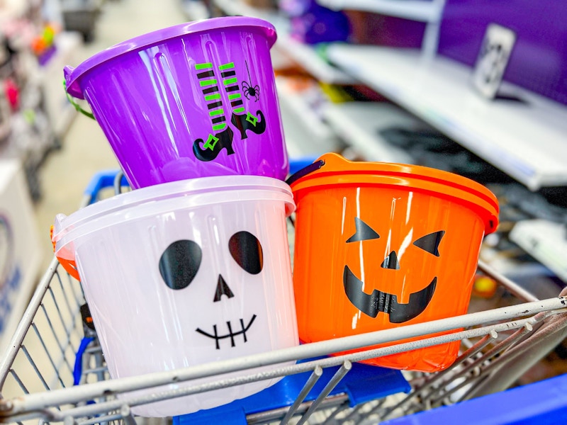 three candy buckets in a blue cart