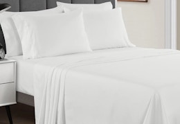 White 4-piece sheet set on a bed.