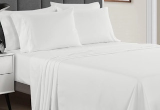 White 4-piece sheet set on a bed.