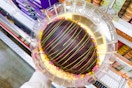 hand holding up a junior's easter egg cake at costco