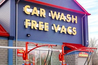 flash car wash exterior with free vacuum signage