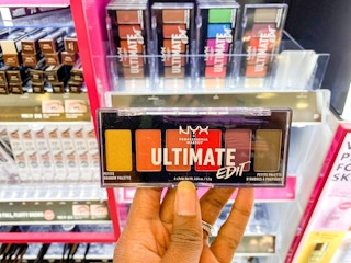 hand holding NYX ultimate edit eyeshadow palette