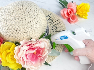 a person makinh a hat spring wreath