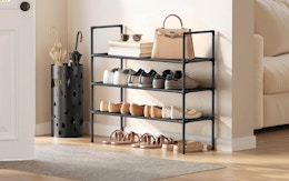 a shoe rack with shoes and a purse next to a door