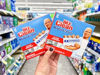 hand holding two mr clean erasers