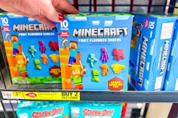 hand touching a box of betty crocker minecraft fruit snacks