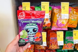 hand holding nice peelable candy halloween package