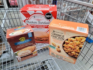chicken sandwiches, chicken cordon bleu, and orange chicken in a cart