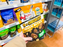 hand holding a package of Dave's Killer Snack Bites