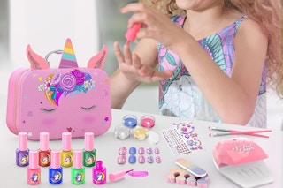 a girl using a nail polish set