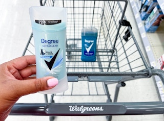 hand holding one Degree deodorant in front of shopping cart with another Degree deodorant inside cart