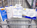 dove shampoo, body wash, and bar soap sitting in a costco cart
