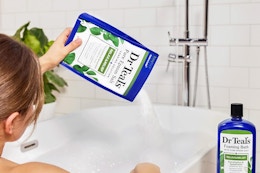 Woman pour bag of epsom salt into her bath water
