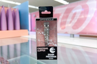 pair of packaged nail clippers on store beauty counter in front of sign with Walgreens logo