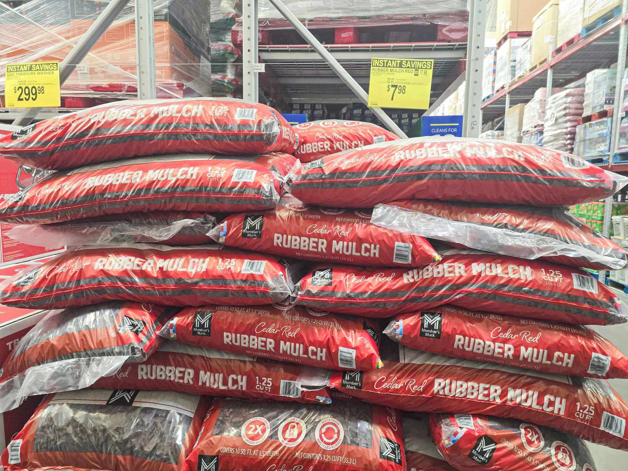 stack of large bags of red rubber mulch