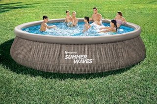 Lifestyle image of Summer Waves pool used outdoors by a group of people swimming