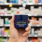 hand holding i dew care glow to bed overnight mask