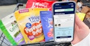 A phone displaying the new Petco rewards program membership in front of a cart of pet supplies