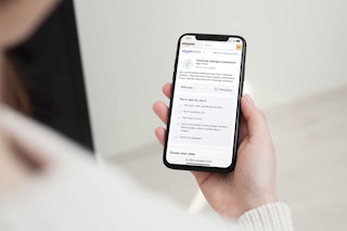 amazon health clinics woman using iphone interface 2022 1669162148 1669162148