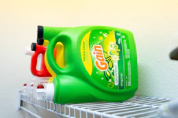 Gain laundry detergent jug on a shelf