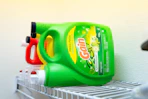 Gain laundry detergent jug on a shelf