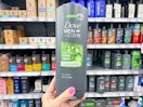 hand holding a bottle of Dove Men+ Care body wash